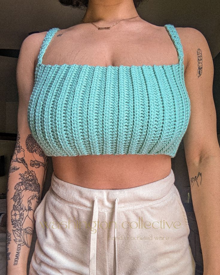 a close up of a person wearing a crop top