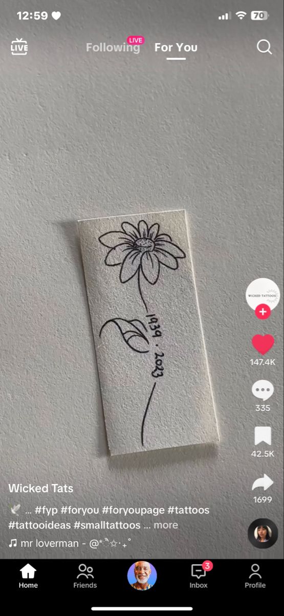 an image of a flower drawn on the side of a wall with text below it