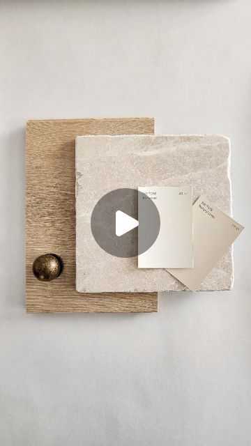 a piece of paper sitting on top of a wooden cutting board next to a metal object