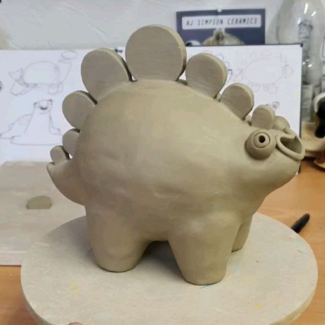 a clay sculpture of a hedgehog sitting on top of a table