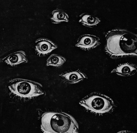 an image of many different eyes in the dark