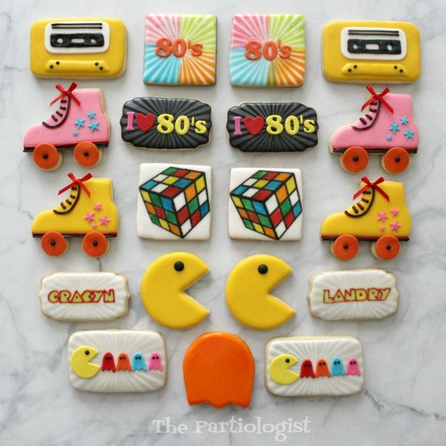 a bunch of decorated cookies sitting on top of a table