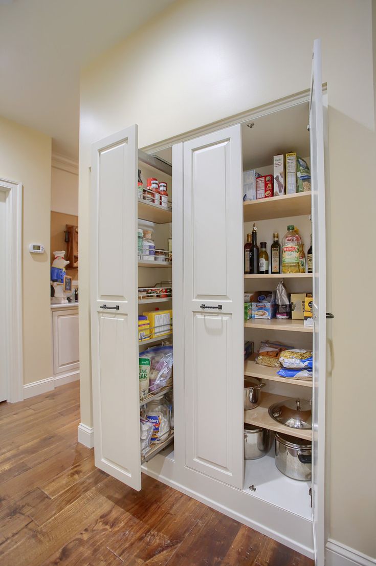 an open pantry with lots of food in it