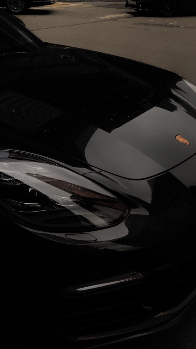 a black sports car parked on the street