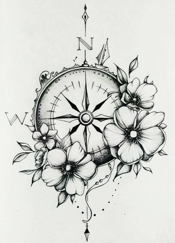 a compass with flowers on it and arrows coming out of the top right hand corner