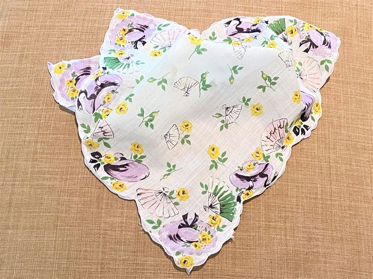 "A pretty vintage handkerchief that has purple hats and fans along the border on a white background with yellow florals and fans in the center. Perfect for a wedding, craft project, quilt, etc. Very soft. It measures 13\" x 13\" It is in great vintage condition with no rips, tears or stains. Please visit my shop to view my entire vintage selection at CobbledStreets: https://www.etsy.com/shop/CobbledStreets?ref=hdr_shop_menu Thank you for shopping at CobbledStreets! **Please Note: All Internation Vintage Handkerchief, Purple Hats, Style Cottage, Vintage Handkerchiefs, Vintage Purple, Romantic Style, Cottage Chic, Purple Floral, White Vintage