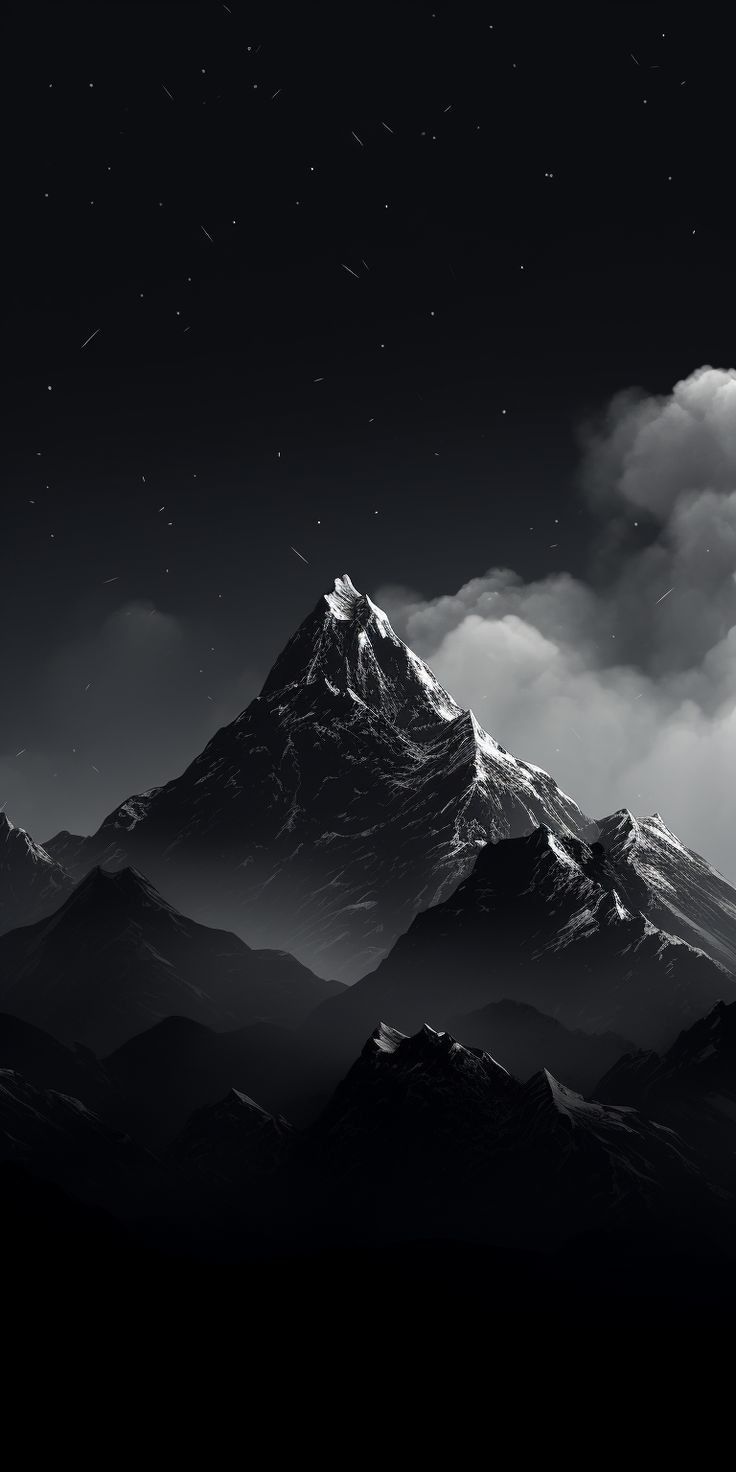 a black and white photo of the top of a mountain with stars in the sky