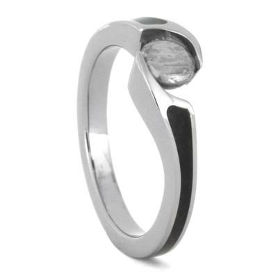 a white gold ring with an oval stone on the top and a black band around it