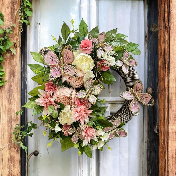 a wreath with flowers and butterflies is hanging on the front door to give it a rustic feel