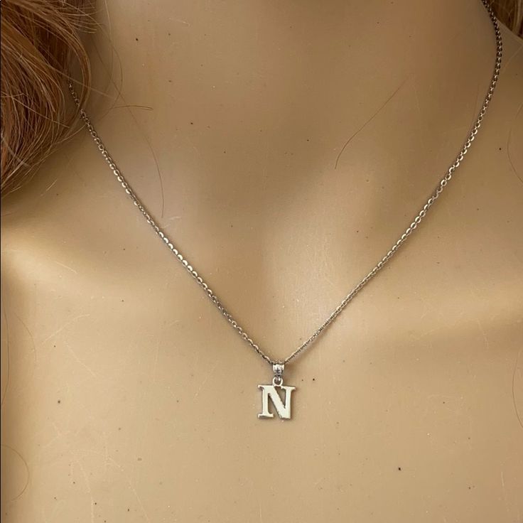 Description: 925 Sterling Silver Mini Small Initial Letter N Pendant Necklace Item No.: H89.Q Metal Type: 925 Sterling Silver (Available In 10k And 14k Gold) Metal Color: Silver Height With Bale: 15 Mm Width: 4.8 Mm Italian Rolo Chain In 16", 18", 20", 22" Available In Another Listings In Any Letter A-Z N Initial Necklace, N Necklace, J Necklace, Shine Jewelry, North Star Necklace, Rectangle Necklace, Small Necklace, Symbol Necklace, Snake Pendant