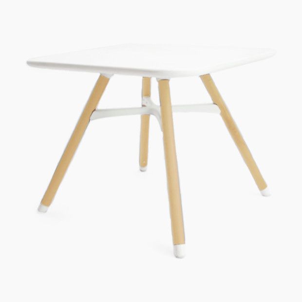 a white table with two wooden legs and a small square shaped table top in the middle