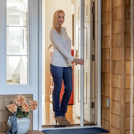 a woman is standing in the door way