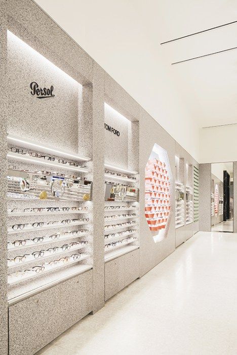 the inside of a store with many pairs of glasses on display