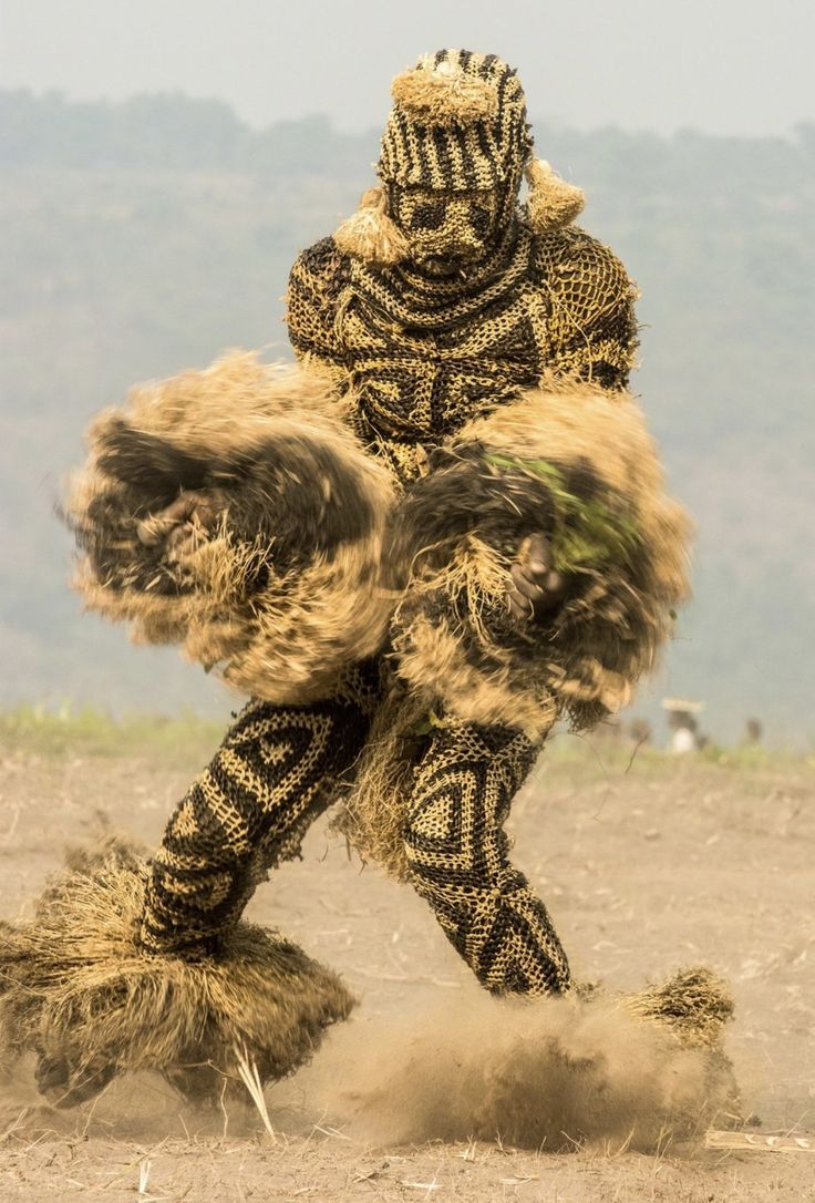 a man in an animal costume kicking up dirt