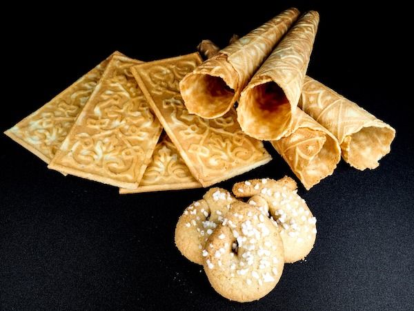 some food is laying out on a black surface and it looks like they are made from bread