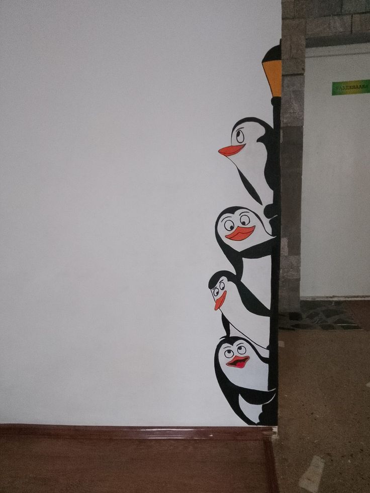 an image of penguins painted on the wall