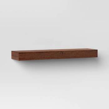 a wooden shelf on the wall with white background