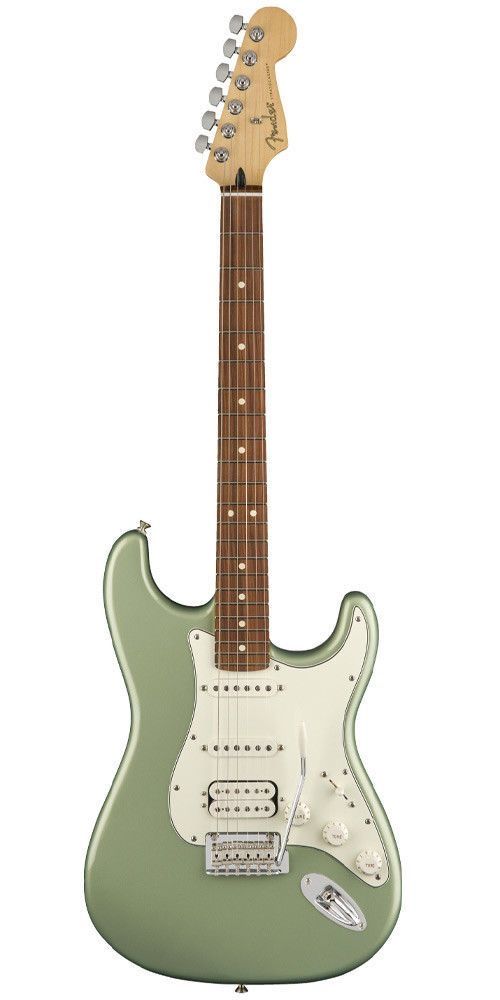 an electric guitar sitting on top of a white surface with a green body and neck