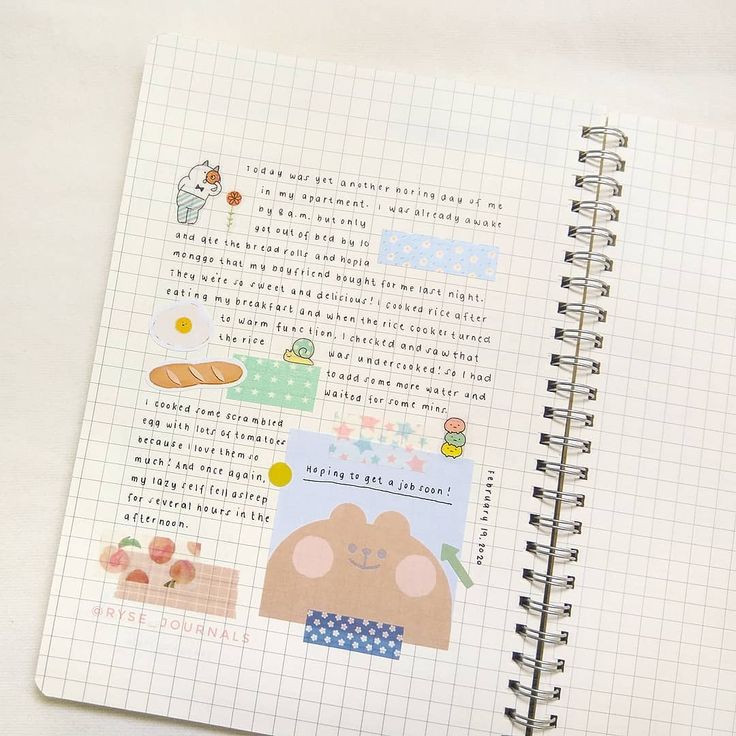 an open notebook with stickers on it