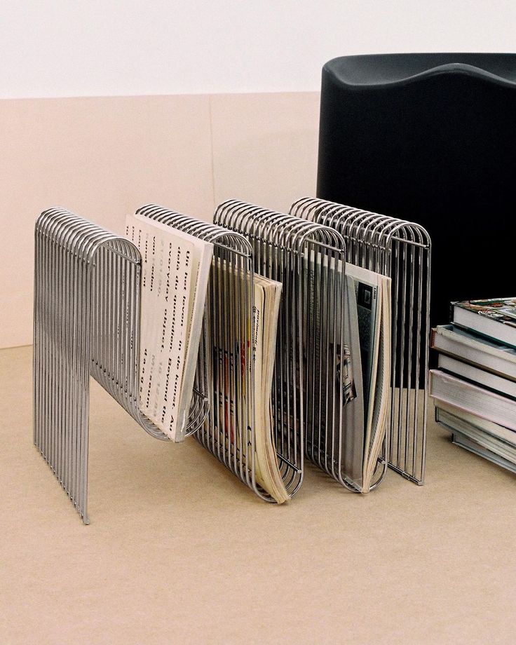 a stack of magazines sitting on top of a table