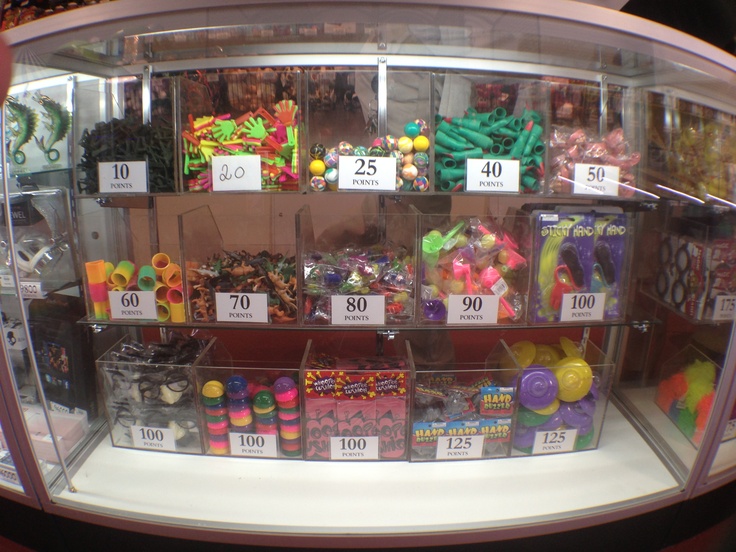 a display case filled with lots of different types of candies and candys in plastic containers