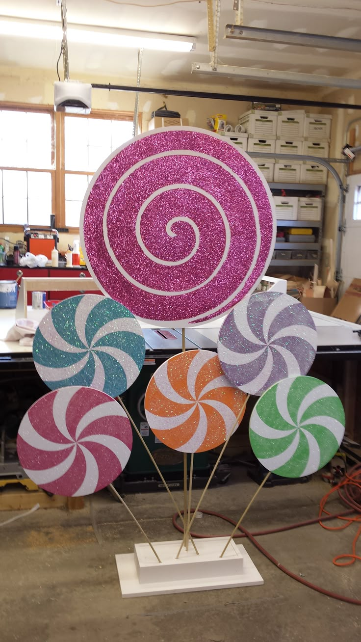 there are many colorful lollipops on display