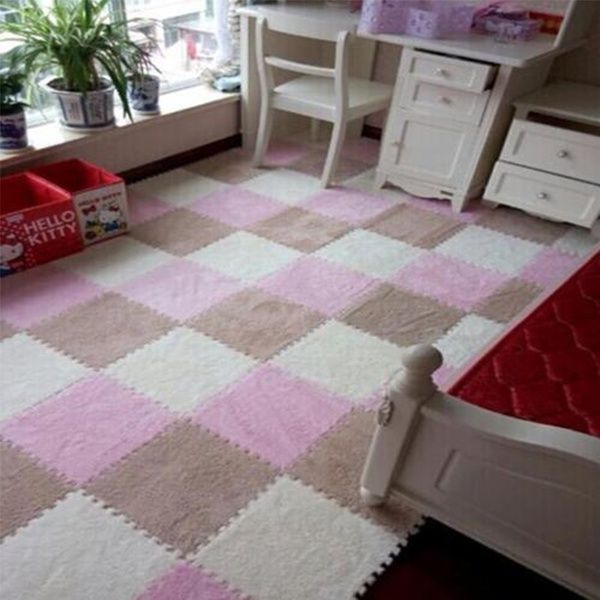 a bedroom with pink and white rugs in front of a bed, desk and window