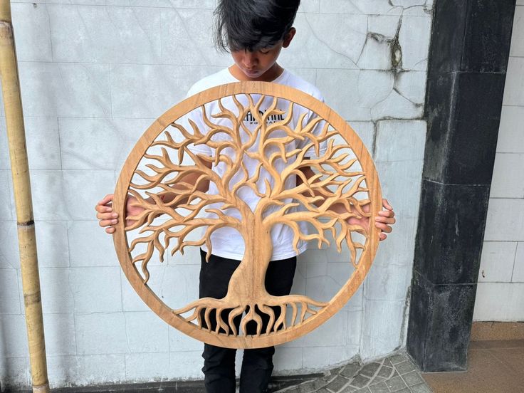 Title:  Embrace Nature with Hand-Carved Tree of Life Wooden Wall Art - 32" x 32" x 1.4" - Symbol of Growth and Strength Description: Introduce the timeless symbol of the Tree of Life into your home with this beautifully hand-carved wooden wall art. Representing growth, strength, and connection, this intricate piece captures the natural elegance of a flourishing tree, making it a perfect centerpiece for any room. Each detail of the tree's branches and roots is meticulously carved, bringing this p Art Representing Growth, Symbol Of Growth, Carved Tree, Wooden Packaging, Tree Carving, Timeless Symbol, Carving Patterns, Embrace Nature, Wood Carving Patterns