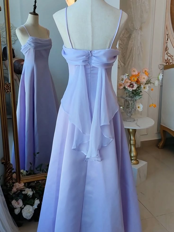 Step into a world of magic and elegance with this stunning Vintage Purple Satin Fairy Dress. The luxurious satin fabric in a dreamy purple hue drapes beautifully, exuding timeless charm and sophistication. The spaghetti straps add a touch of delicate femininity, making it perfect for any enchanting occasion. The highlight of this gown is the whimsical back wings design, adding a fairy-tale-like allure.   Garment Size   	 		 			Size 			XS 			S 			M 			L 			XL 			2XL 		 		 			Bust 			76 			80 			8 Strapless Lavender Dress, Simple Long Purple Dress, Pastel Purple Formal Dress, Periwinkle Dress Aesthetic, Dress Bodice Styles, Vintage Formal Dresses 1950s, Empire Waistline Dress, Draped Back Dress, Dress Draping Ideas