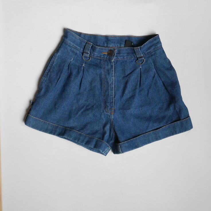 "DESCRIPTION: Cool vintage 70s-80s dark wash denim shorts. High waist, front with pleats. Back and front pockets. Street style! Very good vintage condition - has few almost invisible stains - see last pictures.  Fabric: 100% cotton Size: 42,/ appx M  Measurement Bust and waist already doubled. Waist: 30\" 76 cm Hips: 40\"  102 cm  Length: 15,5\" 39 cm Rise: 15\" 38 cm Inseam length: 3\" 8 cm Best way to know if it will fit? Compare the measurements to similar item from your closet, always allow Classic High Waist Jean Shorts With Belt Loops, Classic High Waist Jean Shorts, Classic High-waist Jean Shorts With Belt Loops, Retro Dark Wash Cotton Shorts, Vintage Short Denim Jeans, Retro High-rise Dark Wash Jean Shorts, Retro Dark Wash Shorts With Pockets, Vintage High Waist Shorts With Pockets, Vintage Dark Wash Shorts For Summer