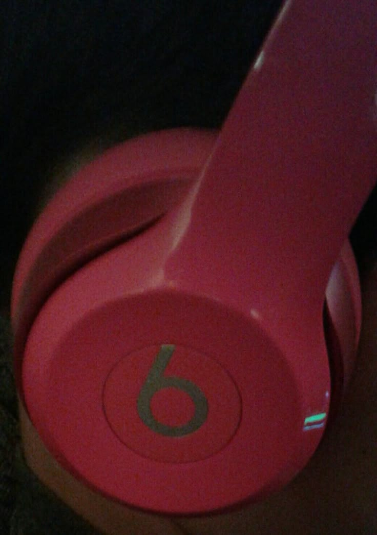 the headphones are pink and have numbers on them