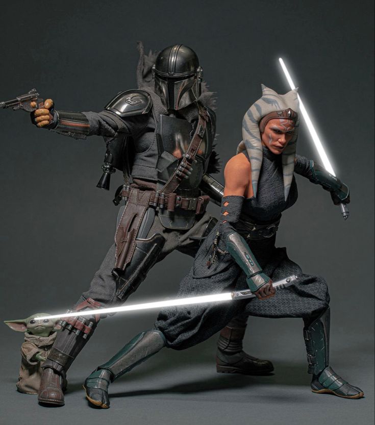 two action figures are posed in the same pose