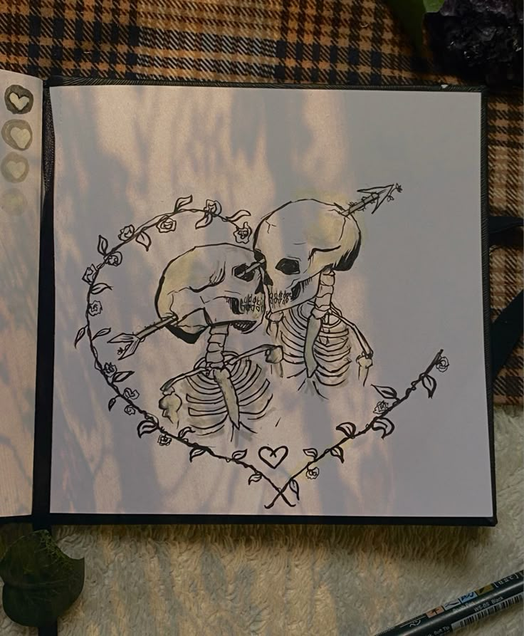 a drawing of two skeletons in the shape of hearts