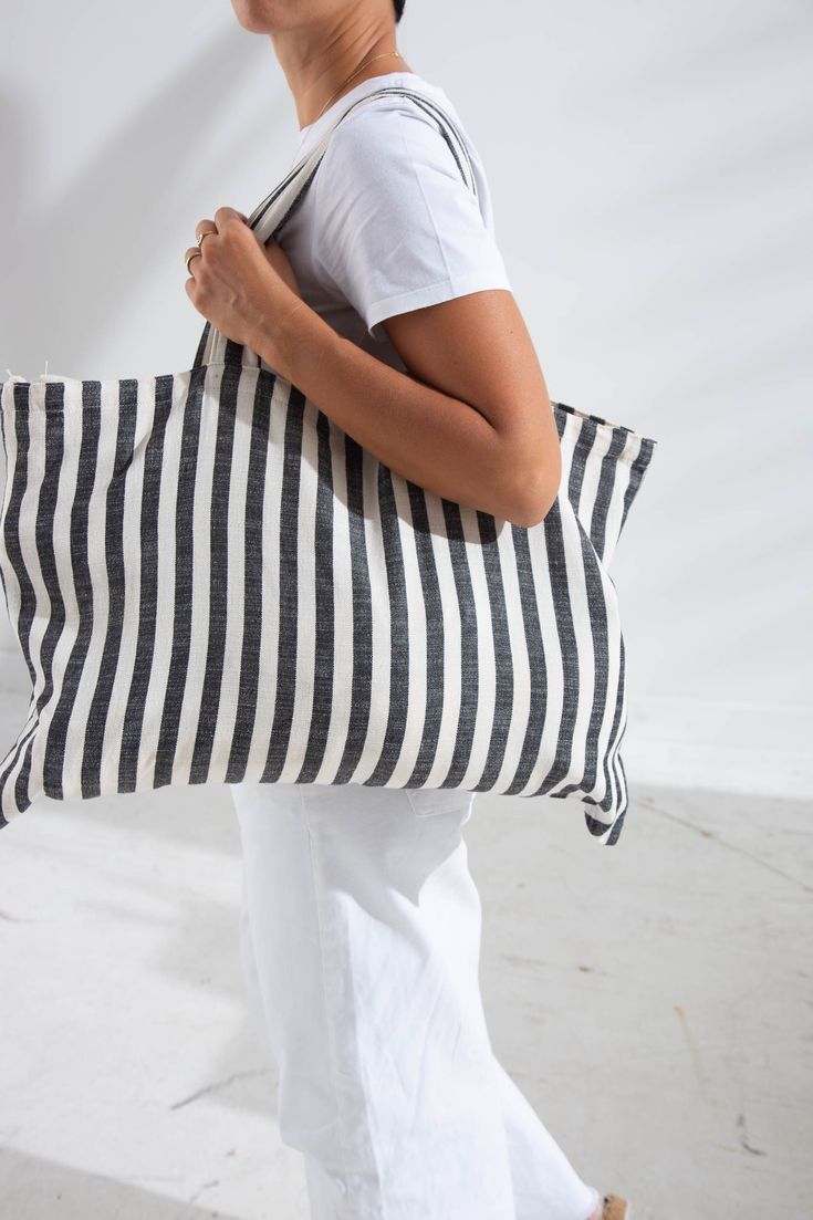 "Oversizde Striped Beach bag, Cotton Handwoven Peshtemal Bag, Natural Cotton Shopping Bag with pocket, Tote Bag, Eco Bag, Oversize Tote Bag, Black and Cream Tote Bag, (22.5\" x 16\") 57x40 cm. Features: Width: 57 cm. ( 22.5\" ) Height: 40 cm. ( 16\" ) Soulder Height: 23 cm. ( 9\" ) Black Striped Bag, a charismatic stance:) 100% Handwoven 100% Turkish Cotton Unlined strong bag Modern Turkish Peshtemal Fabric ( super light ) Suitable for washing at 30 degrees Ideal for going to the beach or for sh Striped Woven Travel Bag, Rectangular Striped Shoulder Bag For Beach, Woven Striped Travel Bag, Striped Rectangular Vacation Bag, Striped Rectangular Shoulder Bag For The Beach, Striped Woven Rectangular Beach Bag, Summer Striped Rectangular Bags, Beach Cotton Bags With Pockets, Cotton Beach Bags With Pockets