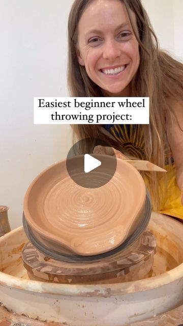 a woman smiles as she holds a pottery wheel with the words, easier beginner wheel throwing project