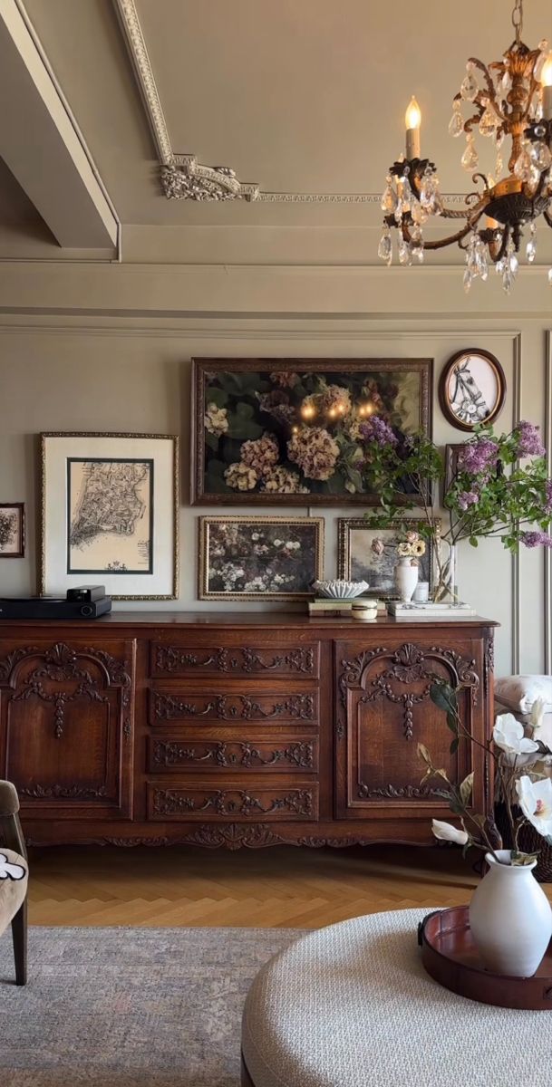 a living room filled with furniture and a chandelier