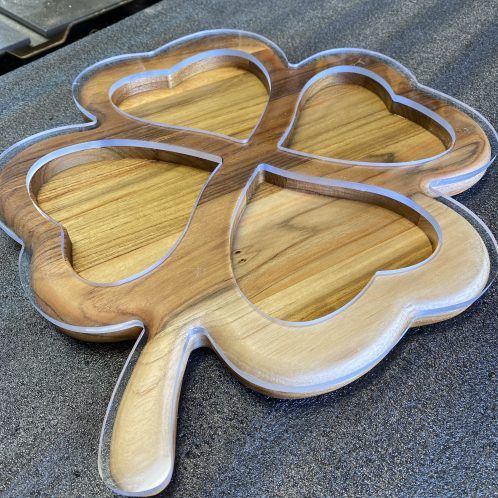 a four leaf clover shaped wooden cutting board