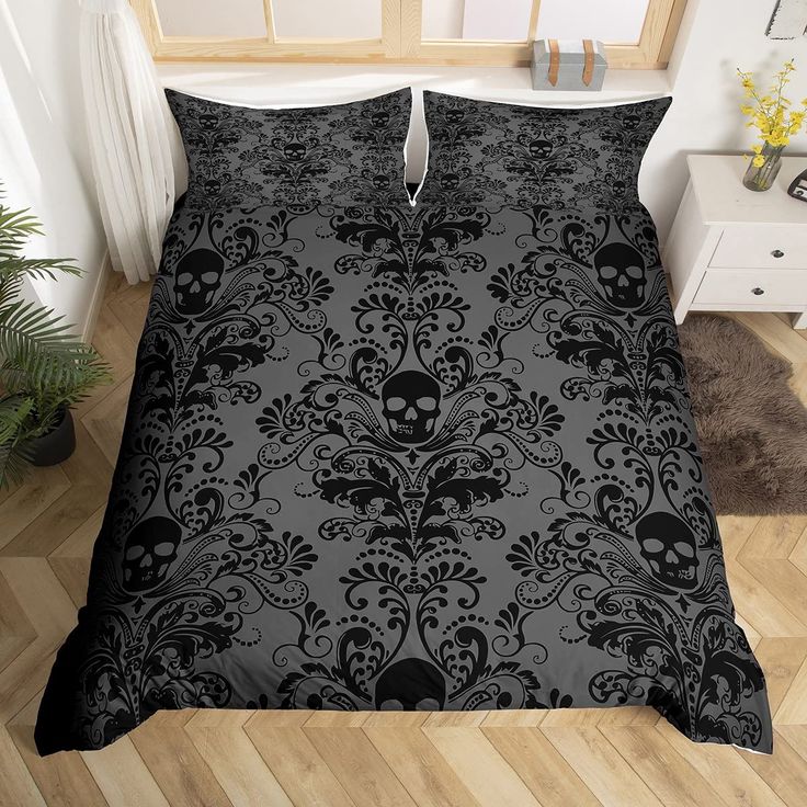 a black and white bed with skulls on it