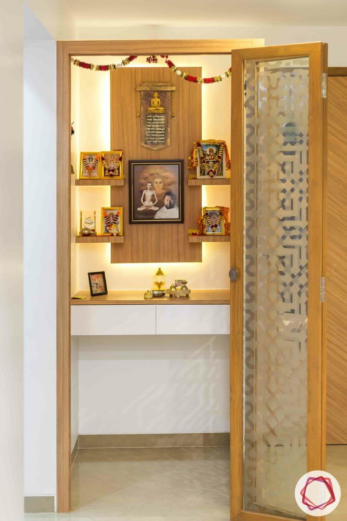 an entry way with shelves and pictures on the wall