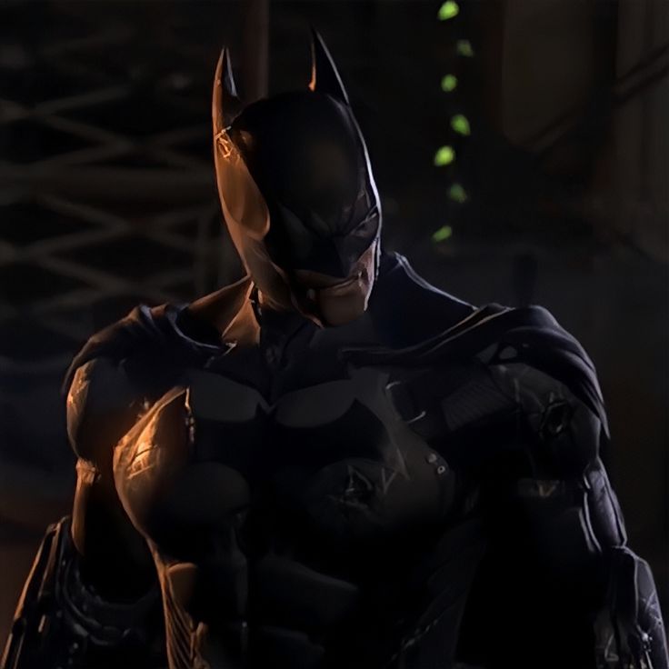 batman in the dark knight costume standing with his hands on his hips and looking at something