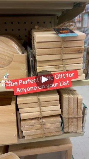 wooden boxes are stacked on top of each other in a display case at a store