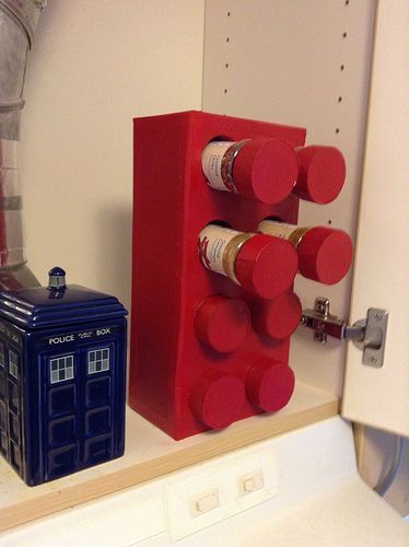 a doctor who is next to a lego thing