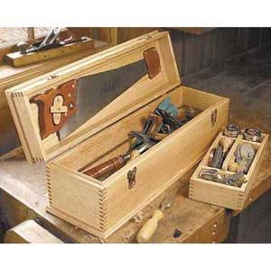 a wooden box filled with lots of tools