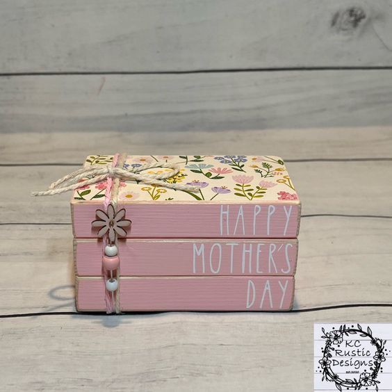 a small pink box with flowers on it and the words happy mother's day