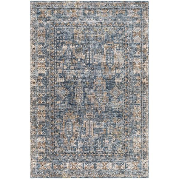 an area rug with blue, orange and beige colors on the bottom half of it