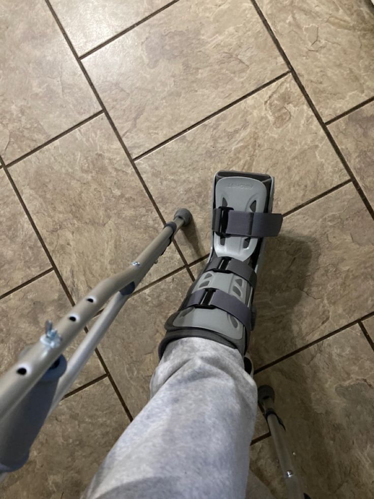 a person standing on top of a tiled floor