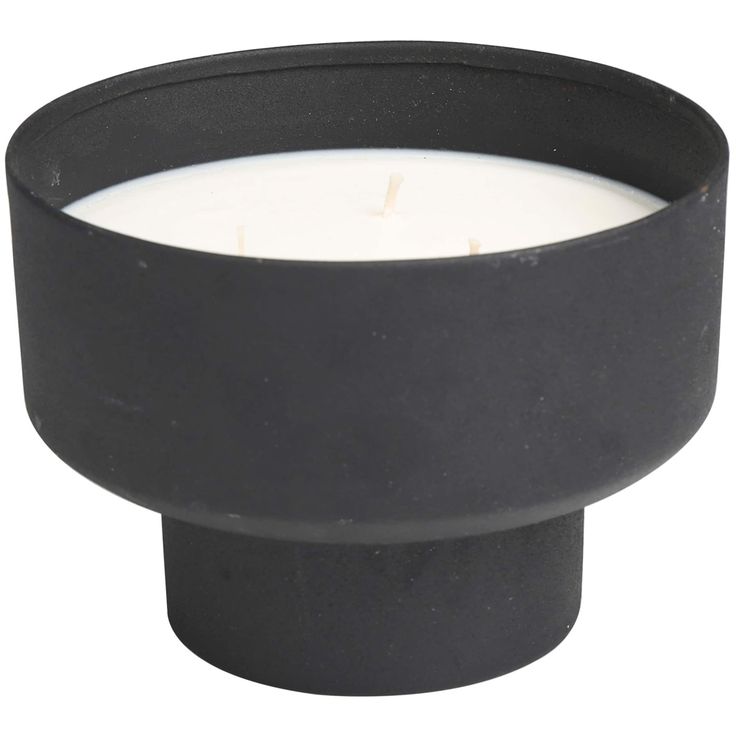 a black candle holder with a white lit candle in it