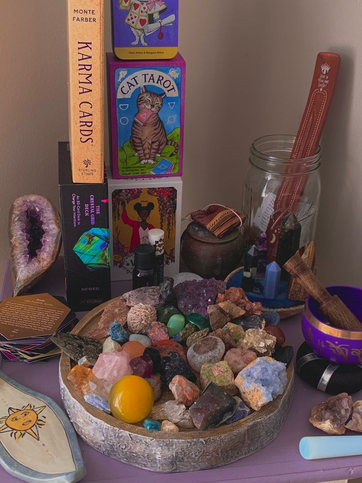 a table topped with lots of different types of rocks and other items on top of it