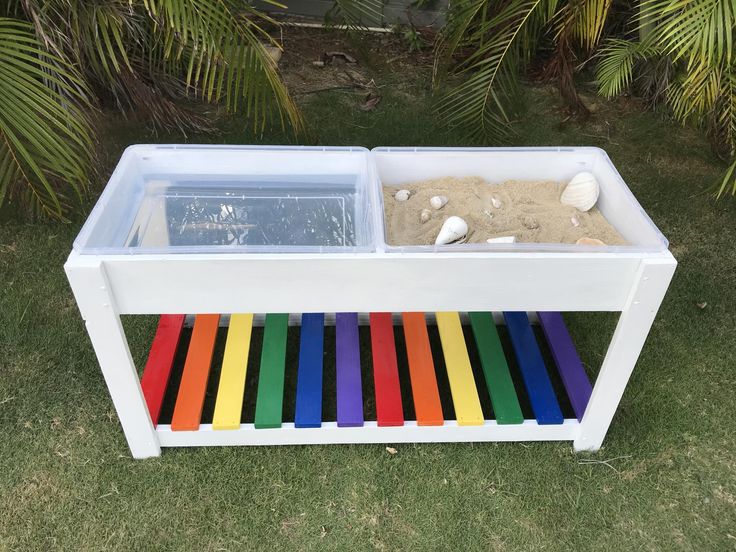 an outdoor sand and water table made out of plastic