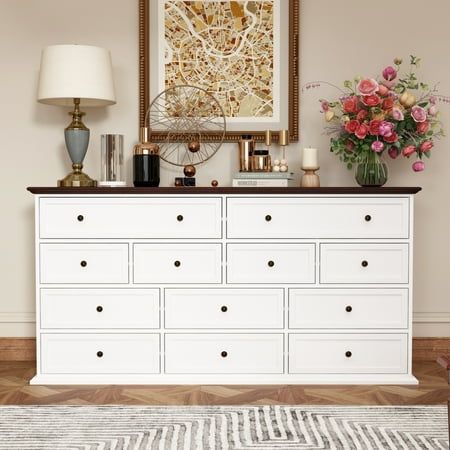 This beautifully crafted piece features a stunning ivory-white finish with a rich brown top, adding a touch of elegance to any room.With its generous dimensions of 31.5 inches in height,61 inches in width, and 15.7 inches in depth, this dresser offers ample storage space to keep your belongings organized and your space clutter-free.The white chest of drawers comes with 12 drawers in 3 sizes for almost kinds of clutter, the drawers are ideal to store clothes, baby toys, books and more items. The Chest Of Drawer, Dresser Chest, Double Dresser, Brown Top, Storage Space, Dresser, Drawers, Bedroom, Living Room